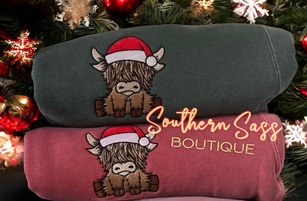 HAPPY HIGHLAND COW WITH SANTA HAT EMBROIDERED SWEATSHIRT